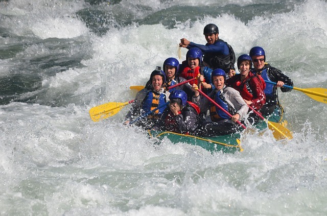 People enjoying team cohesion in rafting