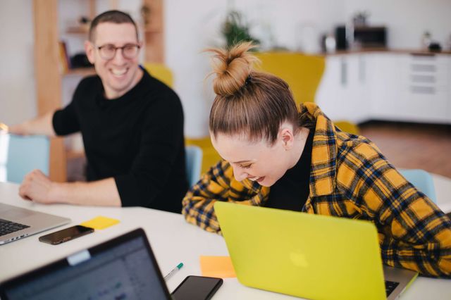 colleagues working and smiling together